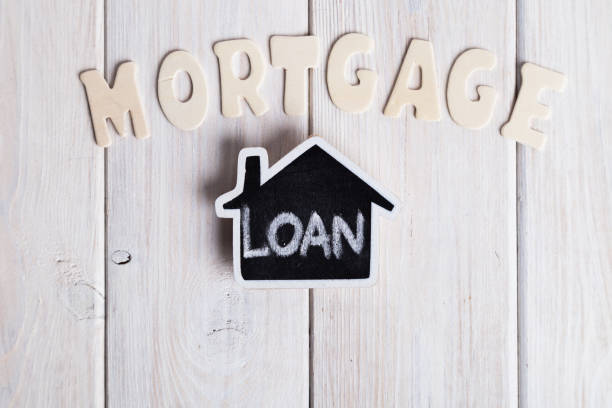 istock Small house over white wood with wood letters 926609918