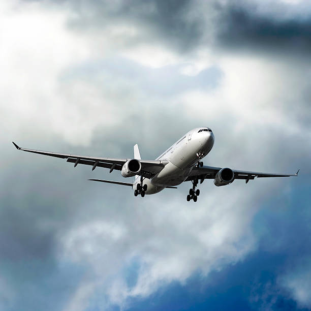istock jet airplane landing in storm 92661285