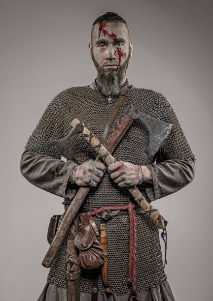 istock Weapon wielding bloody viking warrior soldier alone in studio shoot 926613138