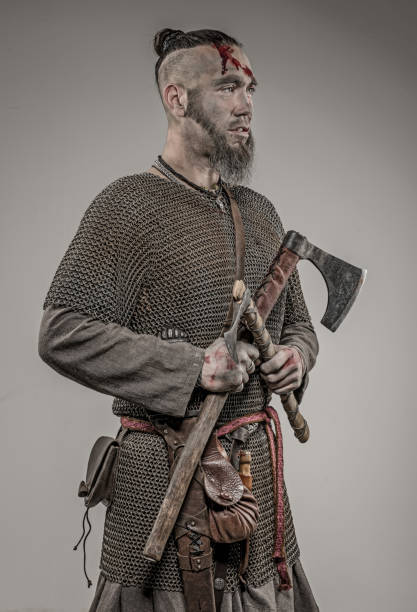 istock Weapon wielding bloody viking warrior soldier alone in studio shoot 926613254