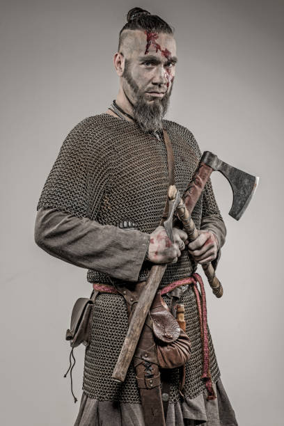 istock Weapon wielding bloody viking warrior soldier alone in studio shoot 926613256