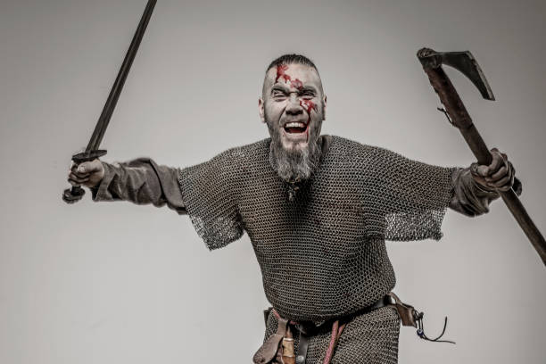 istock Weapon wielding bloody viking warrior soldier alone in studio shoot 926613260