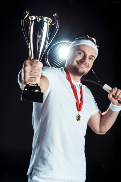 istock tennis player with champion goblet 926614616