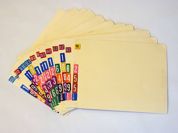 istock A pile of numbered medical files on a white background 92661588