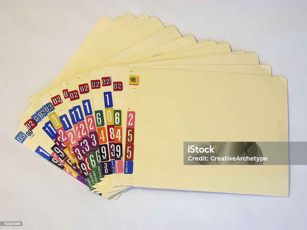 A pile of numbered medical files on a white background Medical files fanned out. Medical Record Stock Photo