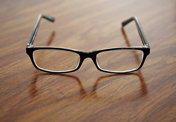 istock Retro Eyeglasses on Wooden Table Top 92661606