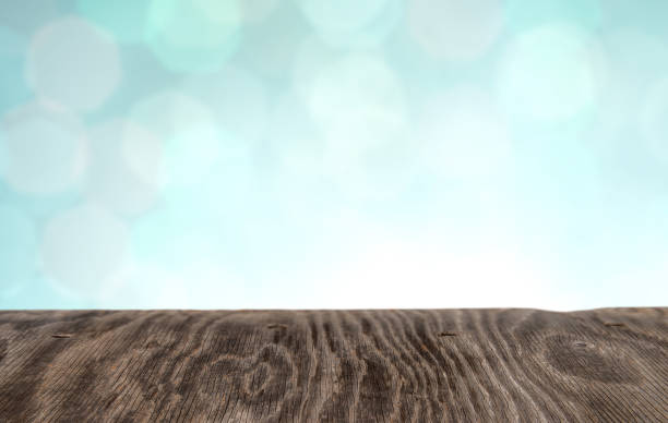 istock Wood table top on shiny bokeh gold background, vintage tone 926617852