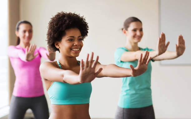 istock group of smiling people dancing in gym or studio 926621380