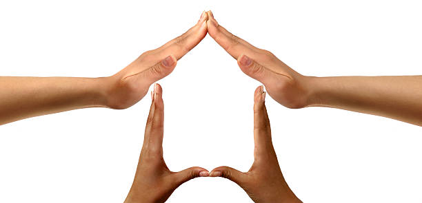 istock Peoples hands forming a home symbol 92662560