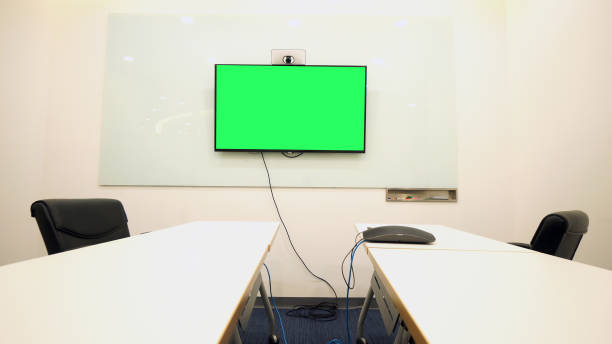 istock Business man having video conference call with green screen 926626168