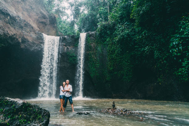 istock Mature couple standing near waterfall 926633268