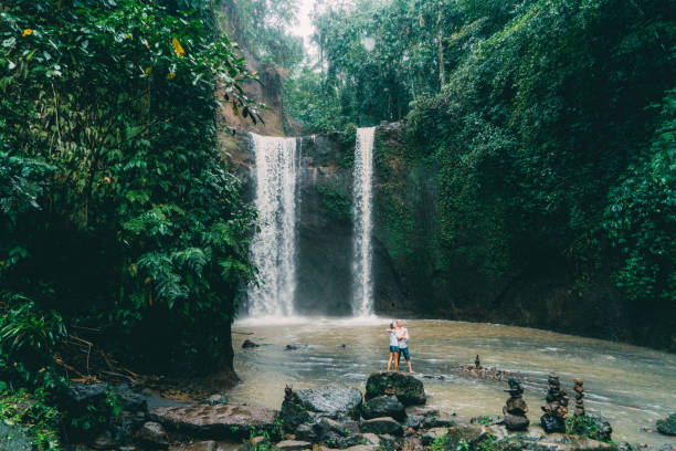 istock Mature couple standing near waterfall 926633348