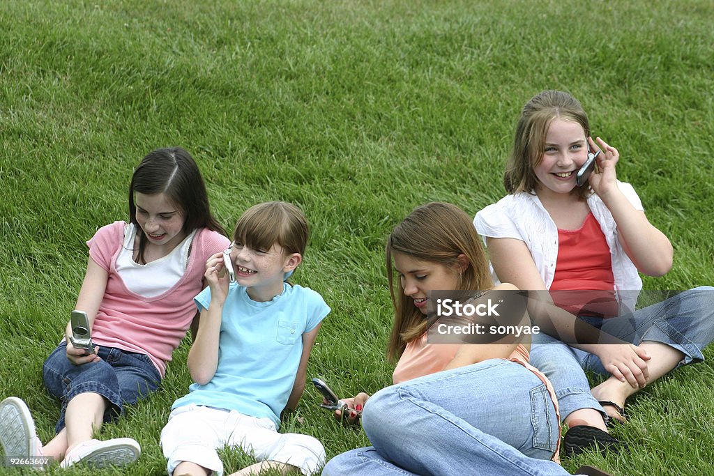 Girls on Cell Phones  Adolescence Stock Photo