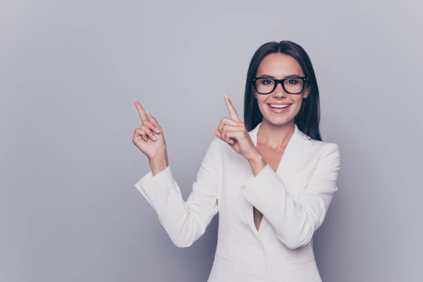 istock Portrait of attractive smart cute beautiful charming confident freelancer pointing on empty blank space, isolated on grey background 926637438