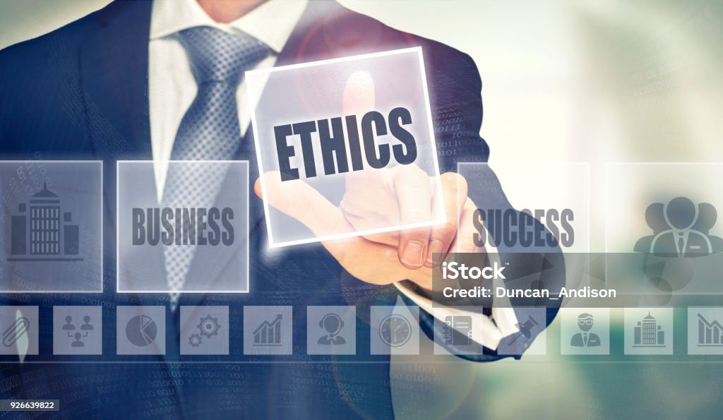 Ethics Concept Businessman pressing an Ethics concept button. Morality Stock Photo