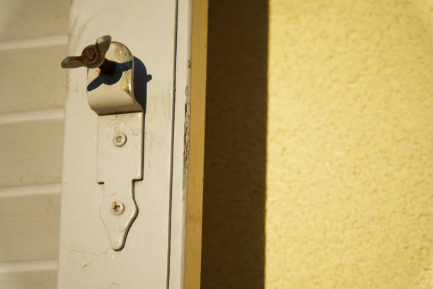 istock Old window latch with already worn white paint. Focused closely and with space for texts. 926639834
