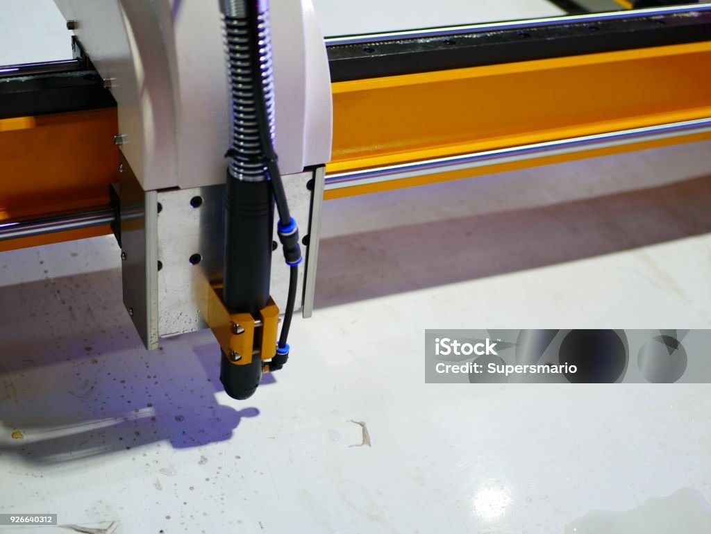 laser cut machine Machine Part, Push Button, Stop - Single Word, Laser, Cutting Automated Stock Photo