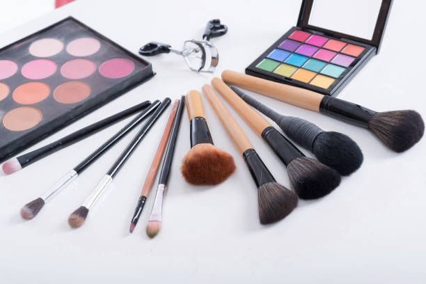 istock Makeup brush and cosmetics isolated on white backgound 926641326