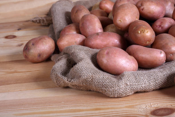 istock Pink potatoes in bag 926641644