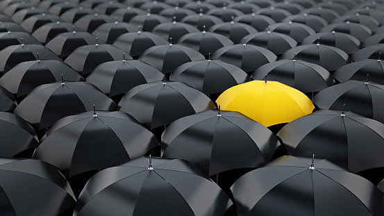 Yellow Umbrella Stands Out Among Black Umbrellas Stock Photo - Download  Image Now - Umbrella, Yellow, Black Color - iStock