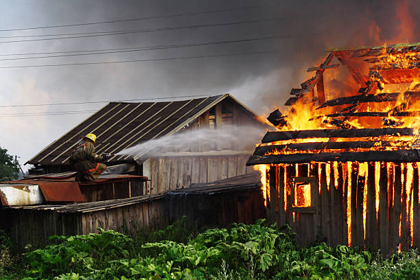 Firefighter on the roof stock photo