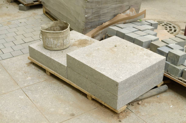 istock Work on replacement of old tiles in the sidewalk. 926649952