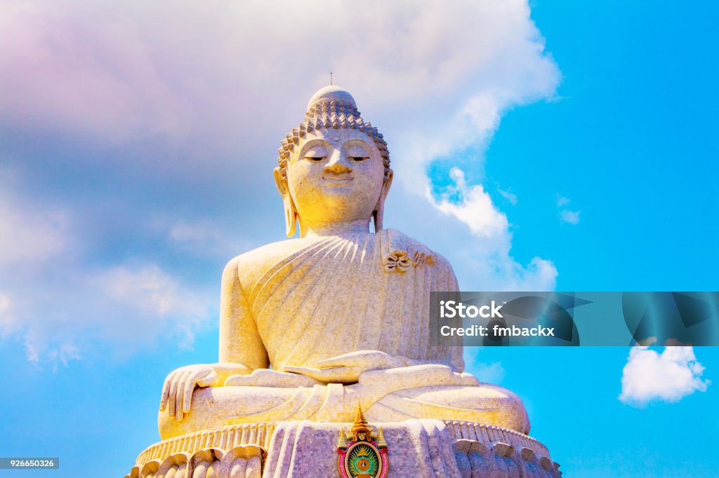 Big Buddha Statue Phuket The big buddha statue in Phuket Thailand against a sky with clouds. No people, isolated from the environment. Phuket Stock Photo