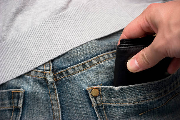 istock Pickpocket stealing a wallet from the back pocket of jeans  92665655