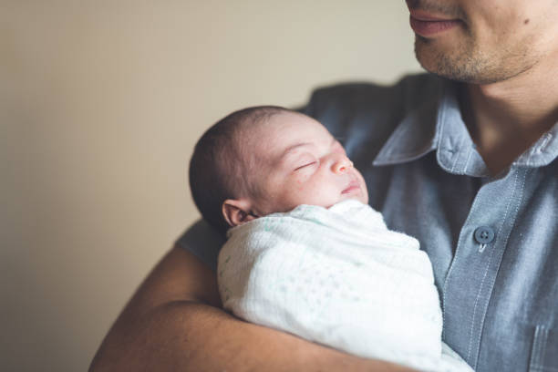 istock New Dad Holding Infant Daughter 926657586