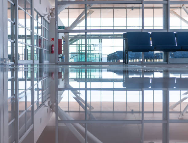 istock Airport terminal, reflection in marble floor 926660714