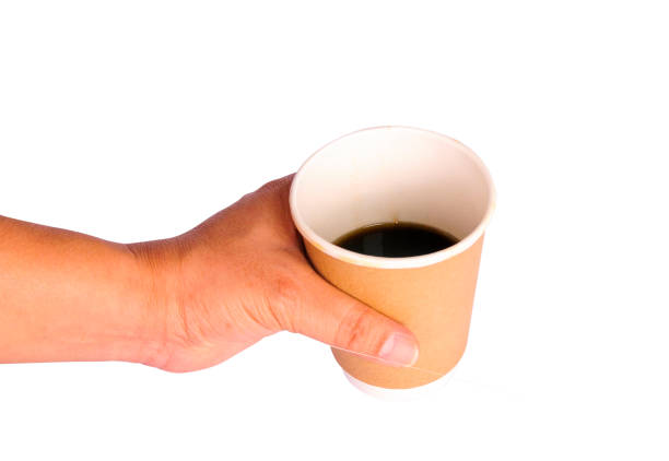 istock Hand holding a cup of coffee on white background with clipping path 926660982