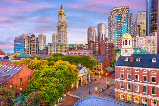 Boston, Massachusetts, USA skyline over Quincy Market and Faneuil Hall.