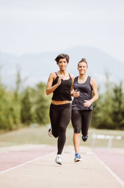 istock woman running on the running track 926667224