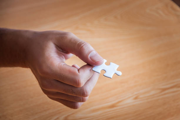 istock Group of business people assembling jigsaw puzzle and represent team support and help concept, Concept for teamwork Building a success. 926670600