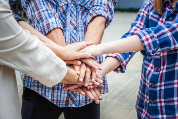 istock Team work concept. Business people joining hands. Teamwork concept,Business team standing hands together in the loft office.people joining for cooperation success business,win in every thing,vintage color 926671006