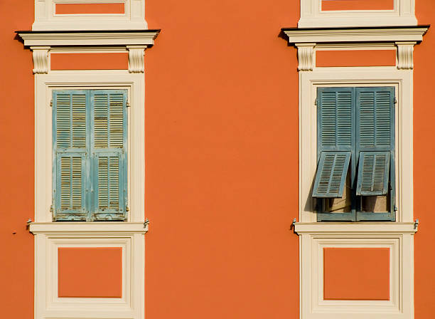 istock Couple of windows upon orange wall 92667304