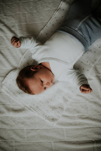 istock Newborn baby boy lying on a blanket 926677052