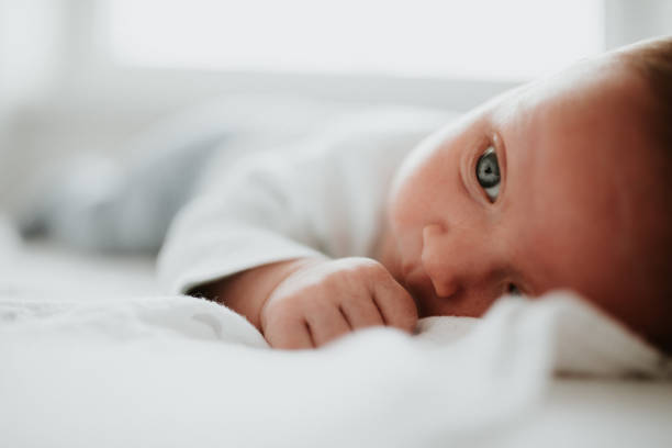 istock Newborn baby boy lying on a blanket 926677140