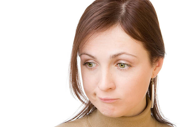 High-resolution close-up of a young woman's face, highlighting her natural beauty, clear skin, and striking eyes.