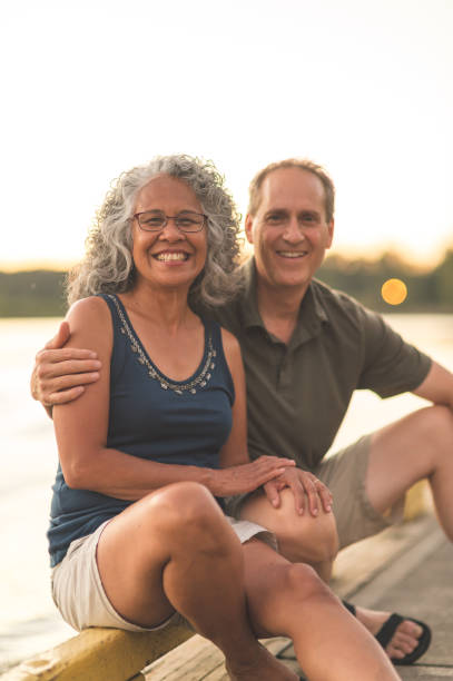 istock Senior Couple Enjoying a River Sunset on the Dock 926680984