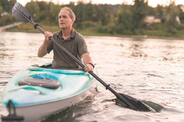 istock An older man kayaks the river on a beautiful summer evening 926680986