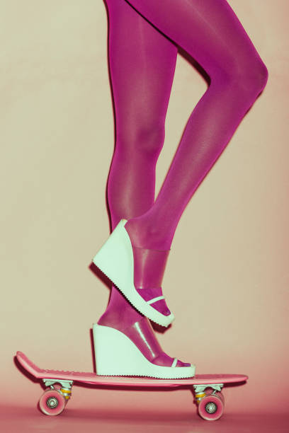 istock girl in heels on penny board 926681644