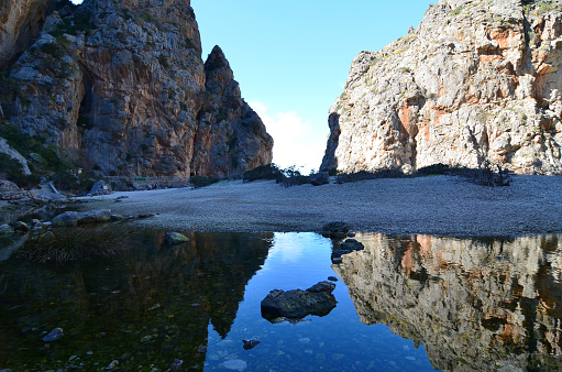 Canyon Torrent de Pareis, Mallorca, blue sky refelcting in water, sunny, wide angle