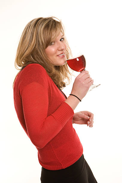 Young woman drinking red wine stock photo