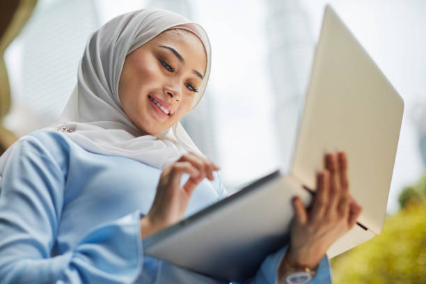 istock Connectivity using a laptop in the city, Kuala Lumpur. 926687128