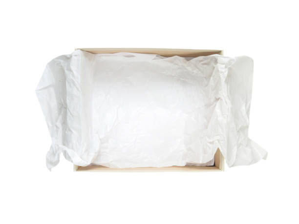 istock Opened shoes packaging cardboard box with crumpled wrapping paper top view isolated on white 926693044
