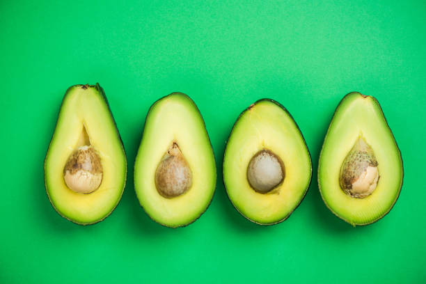 istock Avocado flat lay on green pastel background 926693046