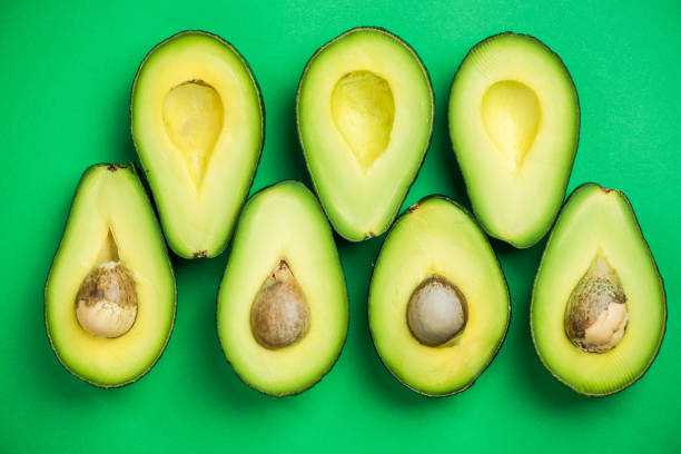 istock Avocado flat lay on green pastel background 926693082