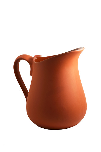 traditional brown ceramic jug on white background
