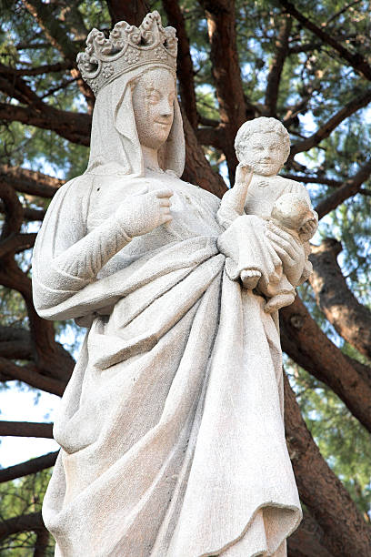 sculpture of Virgin Mary and Jesus - white rock stock photo